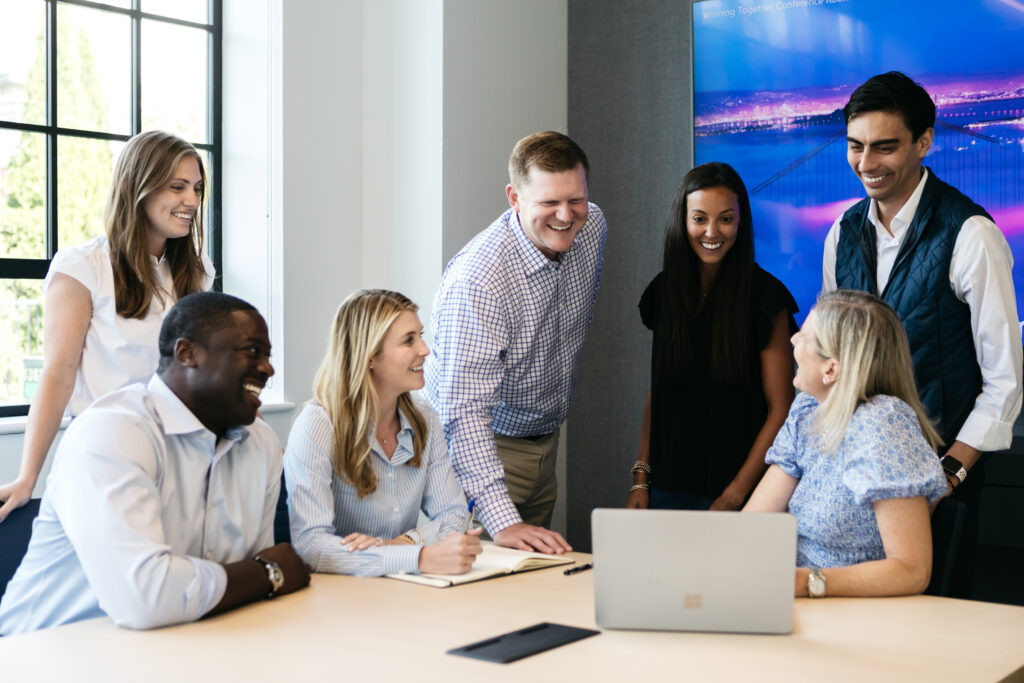 Team Members Smiling in Office